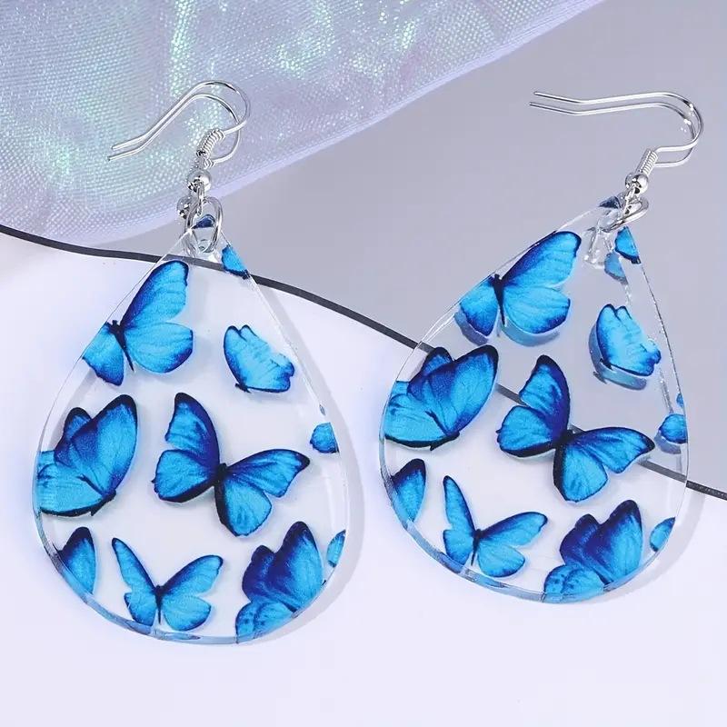 

Модные прозрачные синие серьги-бабочки синий