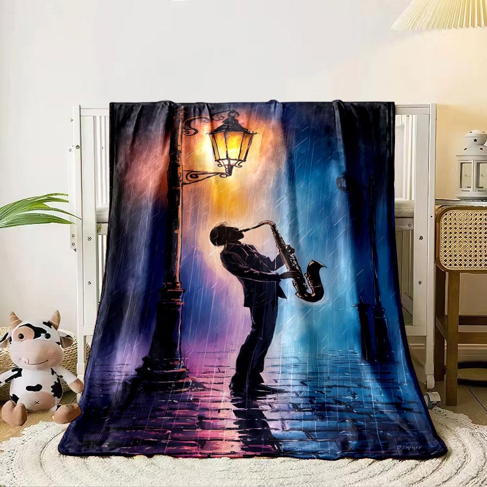 A silhouette of a saxophonist under a glowing streetlamp in rainy hues. for all seasons blanket lunch break throw gift 80cm x 120cm