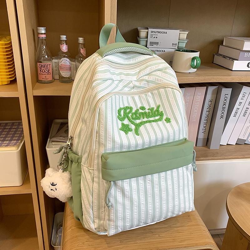 New high-value, fresh and sweet candy-colored striped backpack, high school student large-capacity backpack.