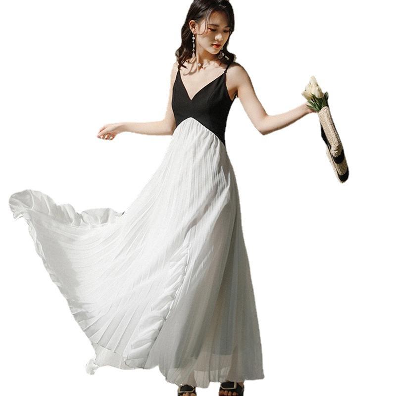 French niche retro black and white splicing irregular ruffle edge super fairy suspender dress women's vacation pleated long dress