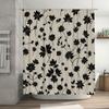 Decorate your bathroom with this elegant black floral shower curtain featuring a modern design and durable fabric for long-lasti