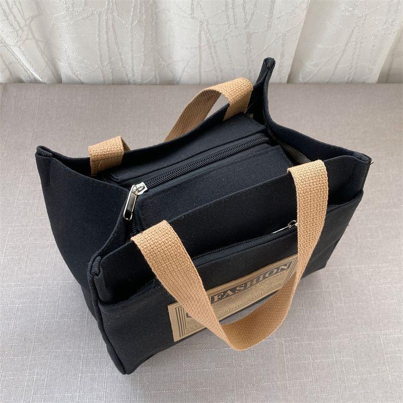 High-value canvas handbag, simple and portable for office workers, casual handbag, lunch box, and handbag.