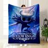 A Character with a Horned Mask and Cloak Stands In a Glowing Blue Scene. for All Seasons Blanket Lunch Break Throw Gift