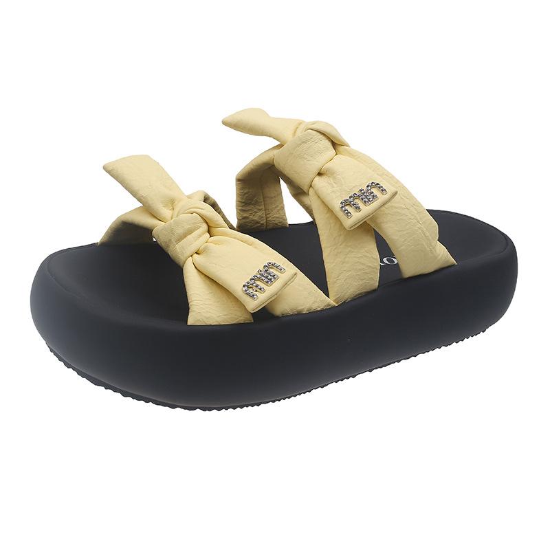 

Thick-bottomed cool slippers for women s outerwear 2025 new summer temperament French fashion high-heeled bow beach with skirt 40