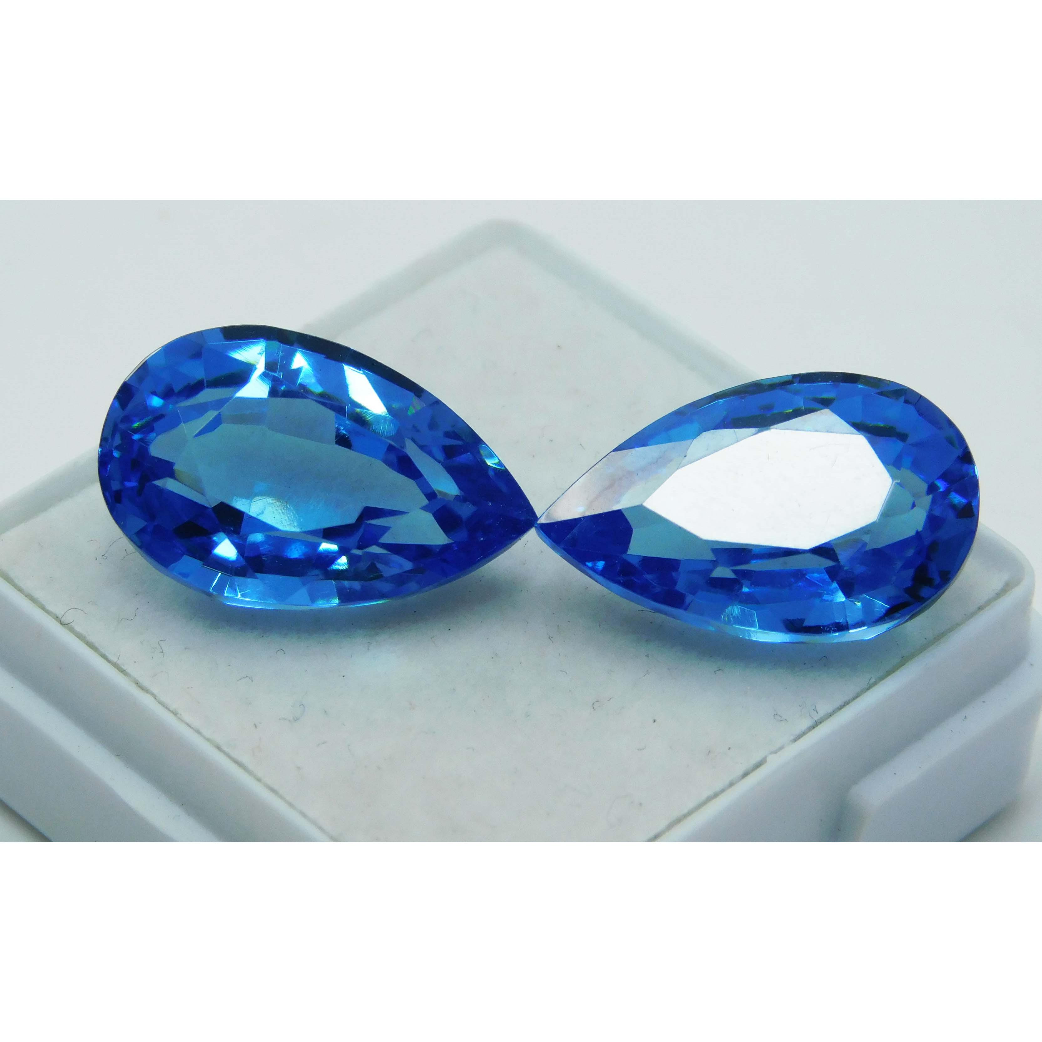 

Light Blue Sapphire 19.30 Carat Natural Pear Shape Pair Loose Gemstone CERTIFIED A-1629 15.5 mm each approx синій
