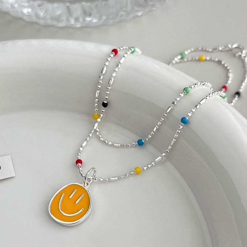 

Ожерелье с улыбающимся лицом для женщин, новая высококачественная цепочка для ошейника с легкой роскошью и небольшим рыночным дизайном, лето