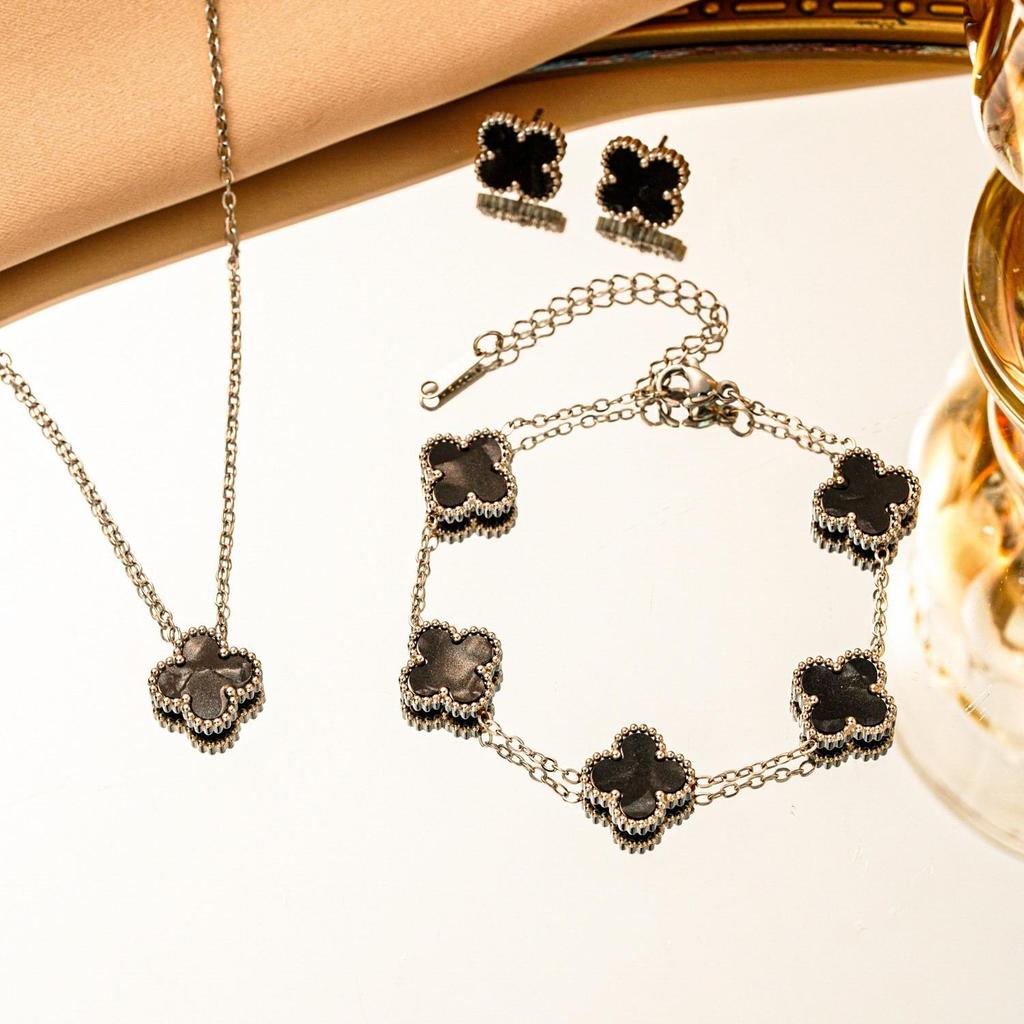 Set 3 pezzi collana bracciale orecchini quadrifoglio double-face in acciaio al titanio
