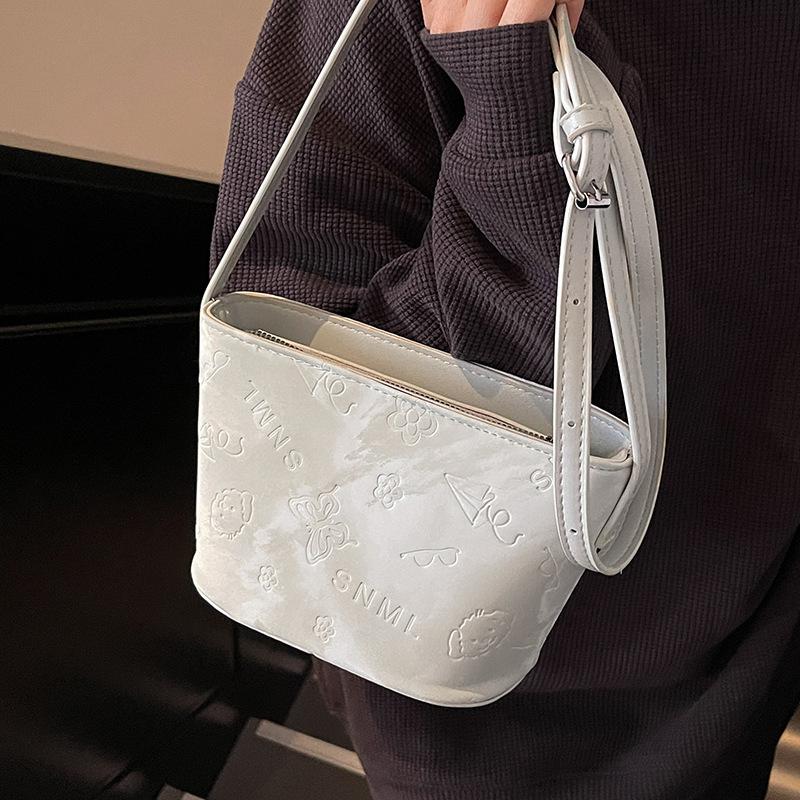 2025 New Simple Style Solid Color Cute Embossed Bucket Bag Niche Versatile Commuter Texture Shoulder Messenger Bag Women