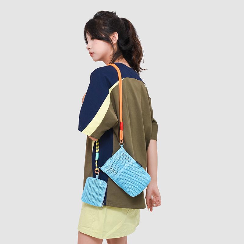 Niche hollow bag women's summer new fashion messenger bag high-end sense child and mother mobile phone bag