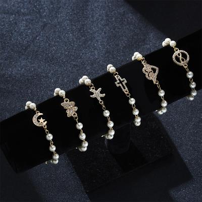 Modische Imitation Perlen Hohl Kreuz Armbänder Für Frauen Klassische Strass Unendlichkeit Stern Mond Schmetterling Herz Armband Schmuck