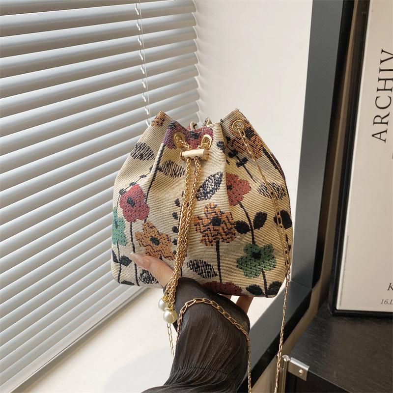 

Women s bag 2025 new retro printed bag women s popular shoulder ethnic style messenger bag drawstring bucket bag women разноцветный