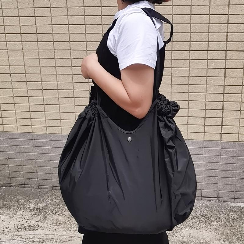 Eco-Friendly Foldable Shopping Tote with Buckle, Drawstring Closure, and Single Shoulder Strap