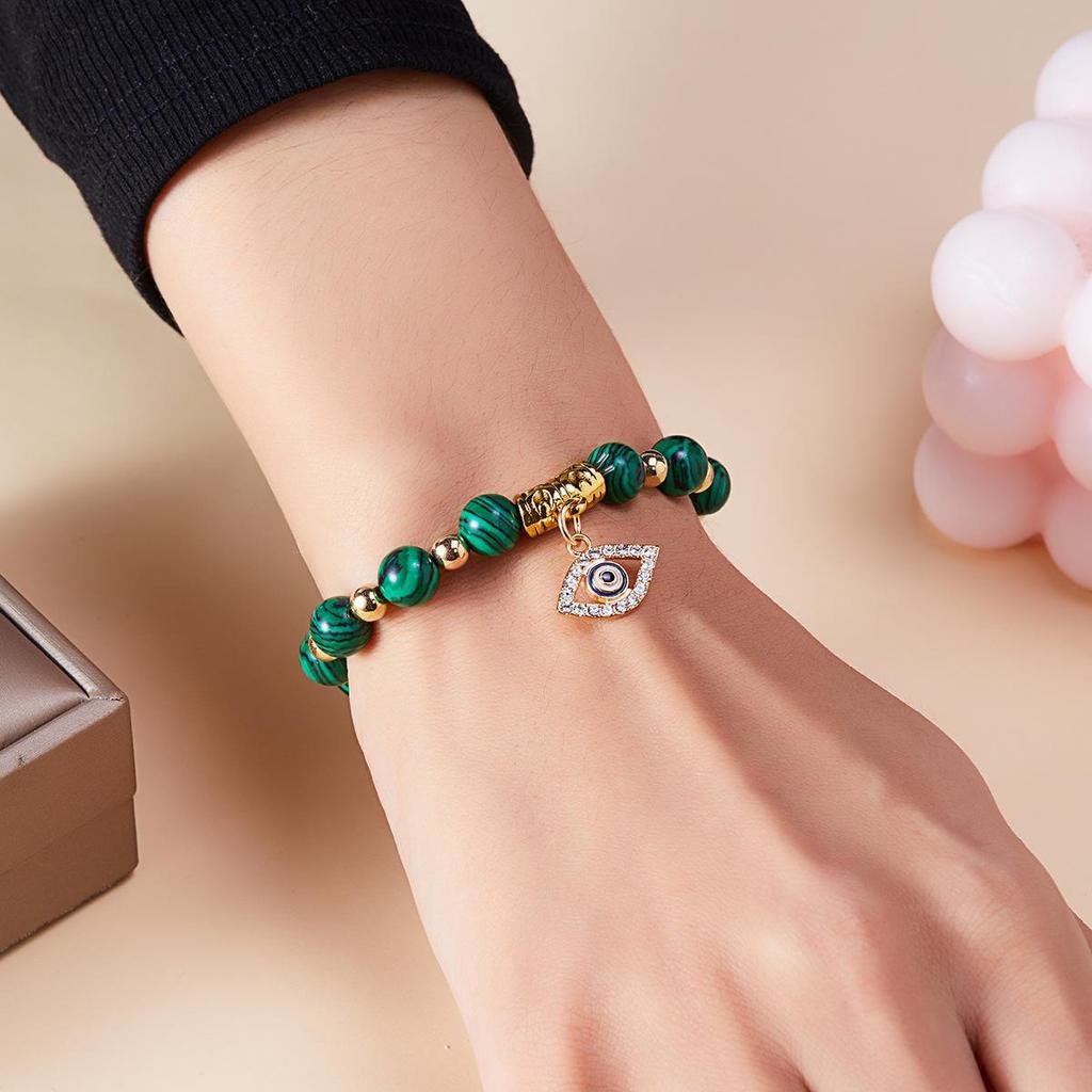 European-American Yoga Energy Bracelet with Natural Stone & Gold Spacer Beads, Featuring a Blue Evil Eye.