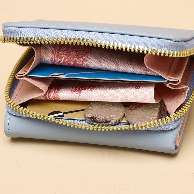 Dámská třískládací peněženka v korejském stylu pro rok 2025 se zipovou kapsou na mince a kresleným designem