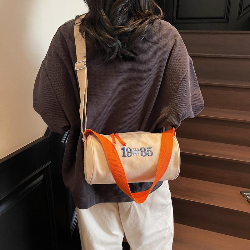 Simple bag 2025 new cylinder bag women's bag messenger bag canvas bag Oxford cloth casual small shoulder bag trend