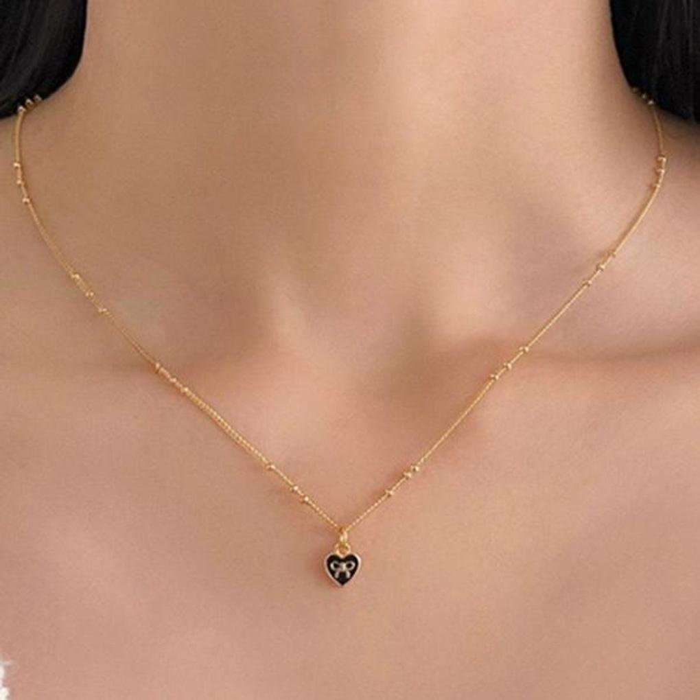 

Жіноче чорне серце з маленькою стрічкою, намисто (2 кольори) gold