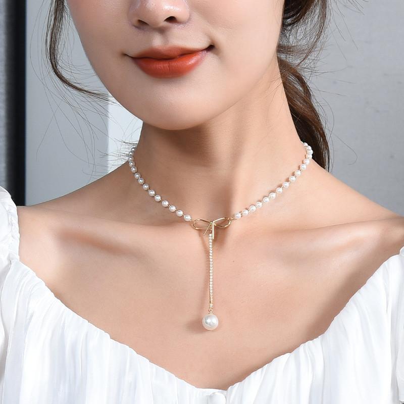 Elegant Butterfly Knot Pearl Necklace For Women In Trendy Korean Style With Unique Design Features