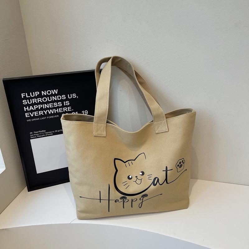 

2025 осень новая холщовая сумка портативная на плечо большая вместимость мультяшная милая модная простая нишевая сумка-тоут хаки