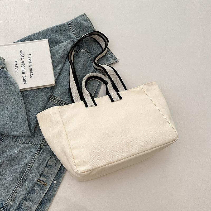 

Женская сумка через плечо 2025 осень новый тренд большая вместимость сумка-тоут модная простая студенческий стиль дорожная холщовая сумка бежевый