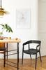 Black Bow plastic chair with armrests