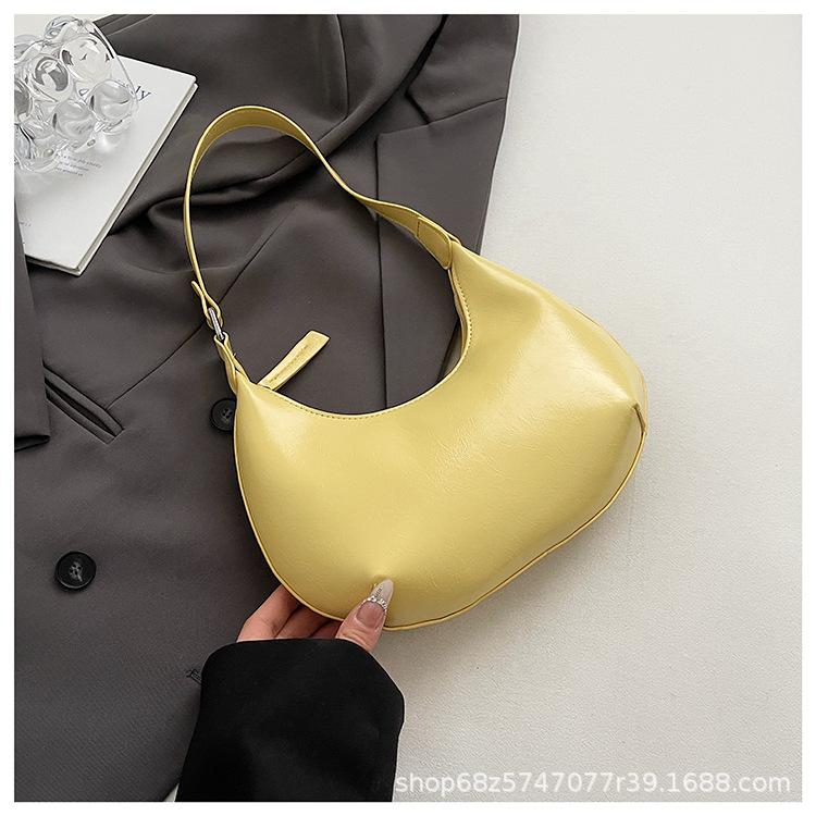 Small bag trend 2025 new fashion handbag high sense versatile women's bag single shoulder solid color half moon armpit bag