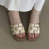 Wearing open toed woven beach sandals with a single low heel for outdoor wear