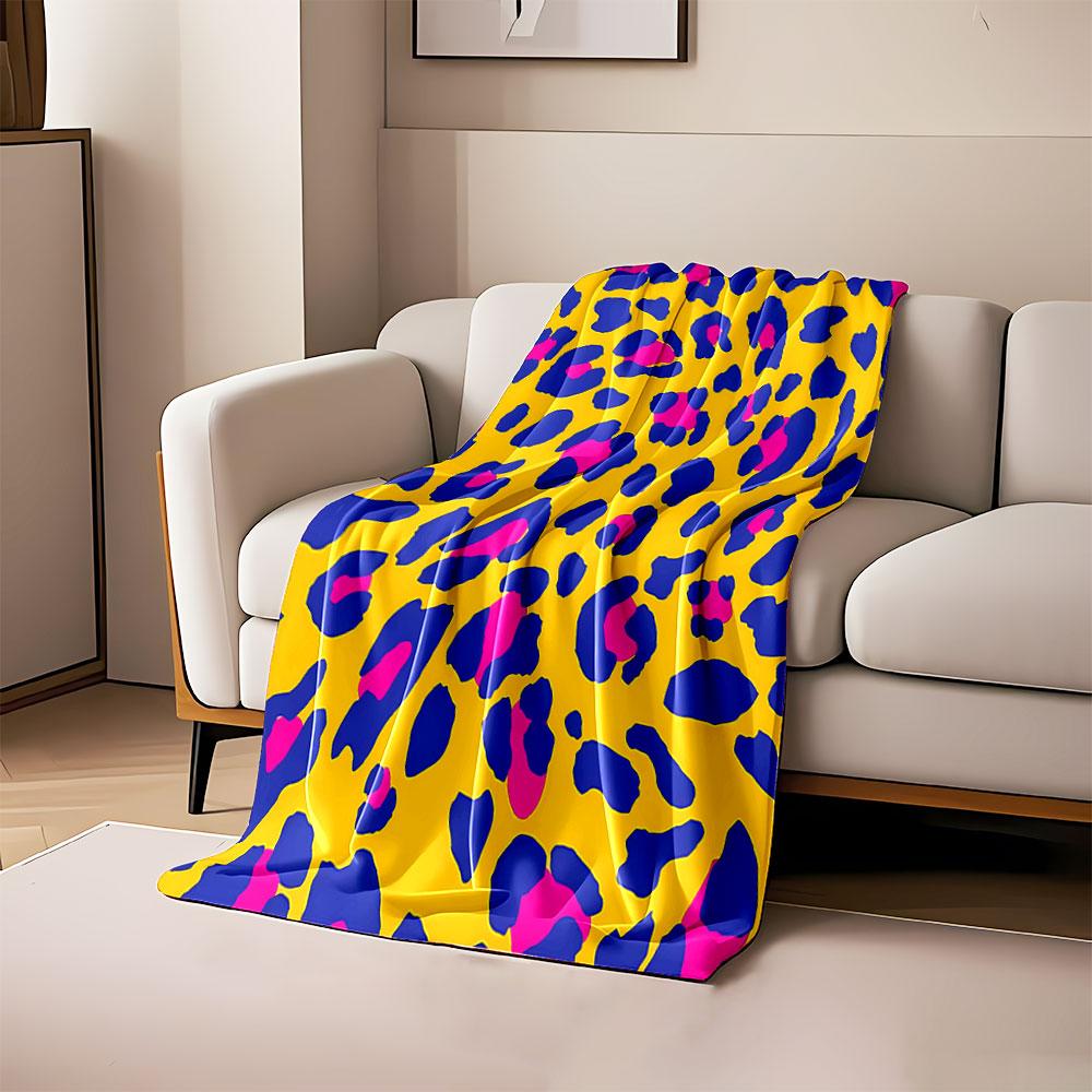 Bright yellow background with irregular blue and pink leopard spots. for all seasons blanket lunch break throw gift 80cm x 120cm