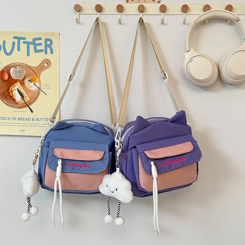 

Sweet cartoon student nylon messenger bag new small fresh commuter shoulder bag casual contrasting color children s small backpack