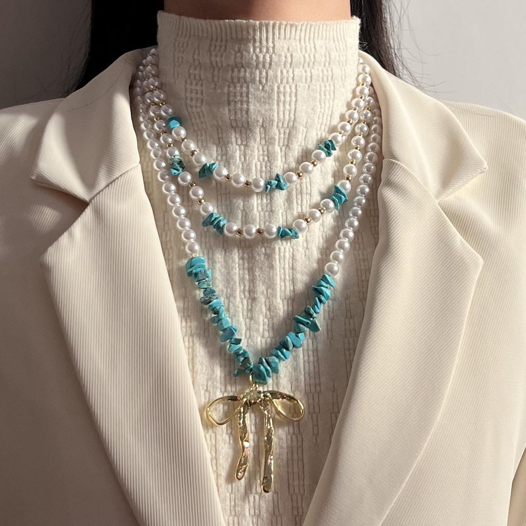 Personalized trend handmade beads multi-layer stacking alloy bow pendant necklace versatile niche design sense