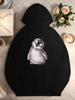 Adorable penguin chick with curious expression women's hoodies