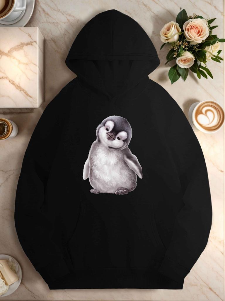 Adorable penguin chick with curious expression women's hoodies
