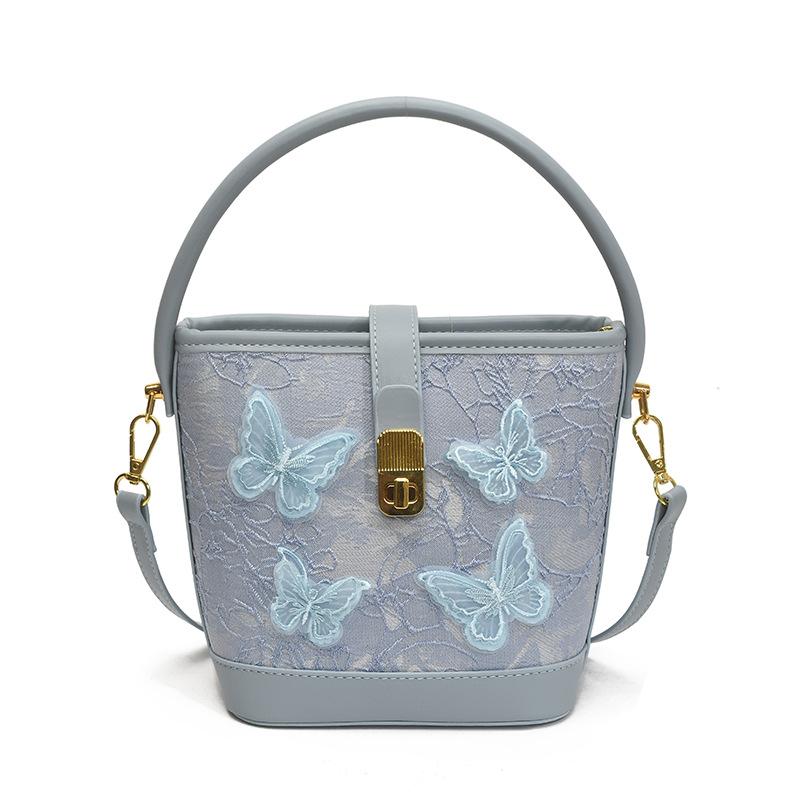 New small bag women 2025 fashion cartoon portable bucket bag versatile texture messenger bag