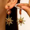 Vintage European Gold Sun Face Pendant Earrings with Amber Glass Tassel