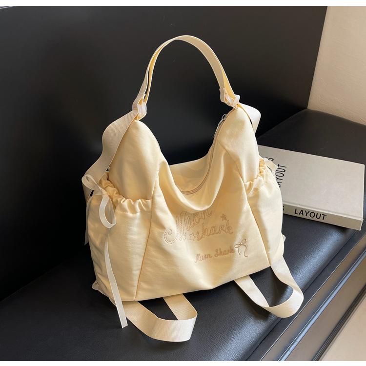 Tote bag women's 2024 new large-capacity commuting letter foreign feeling college students commute to class shoulder backpack