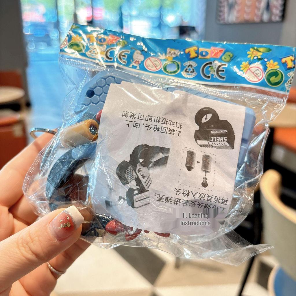 Llavero de Pistola de Anillo Mini Eyectora: Lanzador de Balas Blandas Diseño de Zanahoria, Colgante de Bolso para Hombres y Mujeres, Juguete para Máquina de Garra