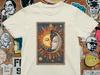 Sun and Moon Kiss Graphic Tee: Celestial Lovers Art Shirt
