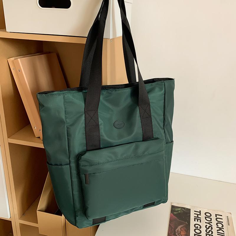 

Сумка з нейлонової тканини Жіноча сумка великої ємності Весна та літо 2024 Нова універсальна тканинна сумка через плече для приміських поїздок зелений