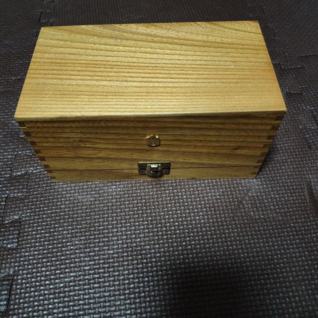 Used Abu Garcia baitcasting reel with wooden case