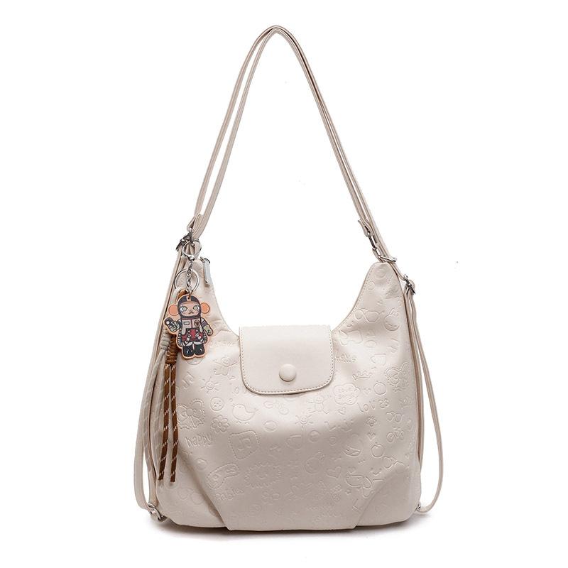 High-quality new niche cute graffiti embossed large-capacity tote bag light casual soft leather multi-back shoulder bag