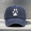 A Baseball Cap Featuring a White Blurry Paw Print Design Suitable for Outdoor Activities And Hiking with a Vintage Washed Look