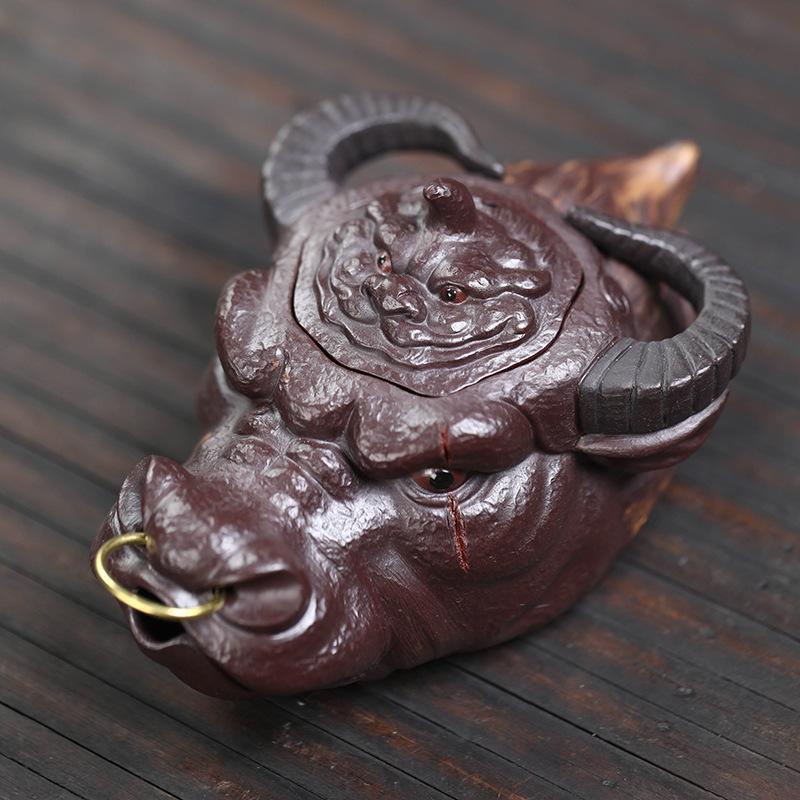 Yixing purple sand raw ore handmade cow fair cup tea pet ornament cow head hand grab pot fair cup bubble teapot gift