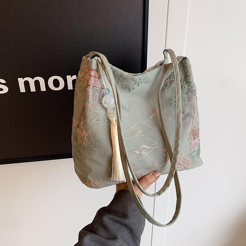 Borsa a tracolla ricamata di grande capacità Borsa estiva alla moda in tessuto da donna Borsa a tracolla con ricamo di nicchia Borsa a secchiello con texture Borse in tela