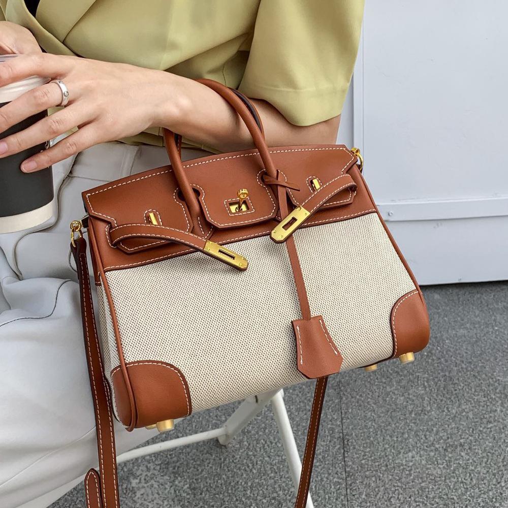 

Новая парусиновая и кожаная сумка с платиновым цветовым блоком, ретро и модная, большая вместимость, ручная сумка для поездок, контрастный цвет, замок, сумка через плечо 30x17x22cm