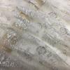 The New Elastic Silver-white Lace Embroidered Fabric Can Be Used for Wedding Dresses Evening Gowns and Designer Clothing Fabrics