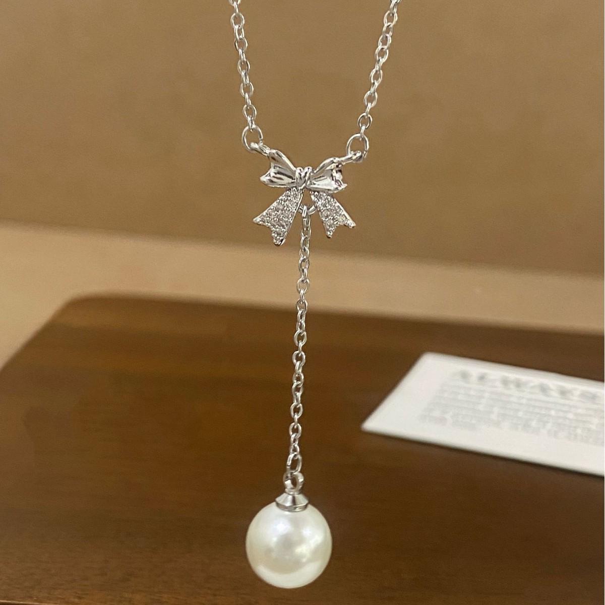 French Exquisite Silver Bow Pearl Tassel Necklace with Cubic Zirconia – Versatile Niche Design for Women.