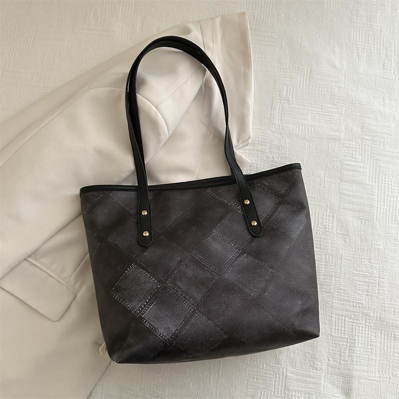 Geräumige und stilvolle schwarze Canvas-Tragetasche für Damen, perfekt für Uni und Arbeit