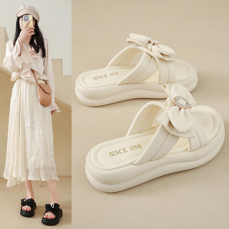 Stepping on shit slippers fairy style women's models 2025 summer new models wear thick-bottomed bows with skirts cool slippers