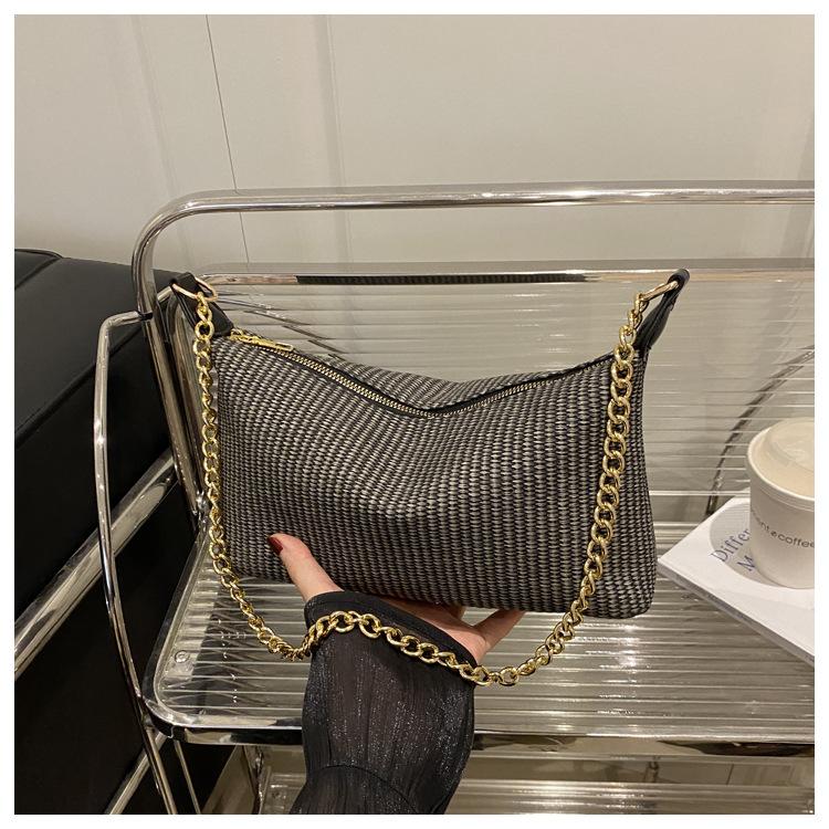 2025 new holiday style straw weaving women's summer popular weaving seaside beach large capacity chain shoulder tote bag