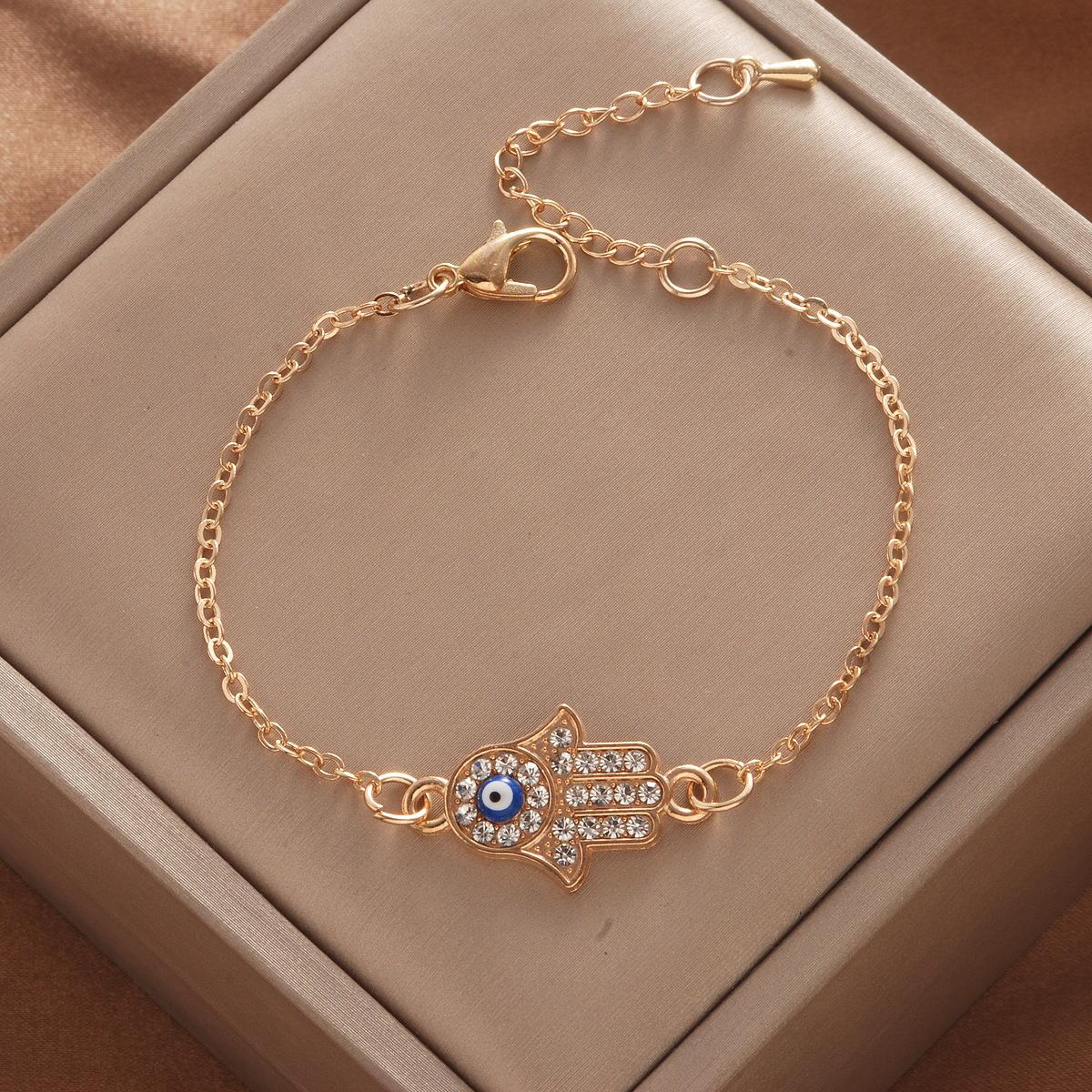 

Женский браслет из титановой стали в форме руки, с кристаллами цвета Дьявольский синий зрачок one size