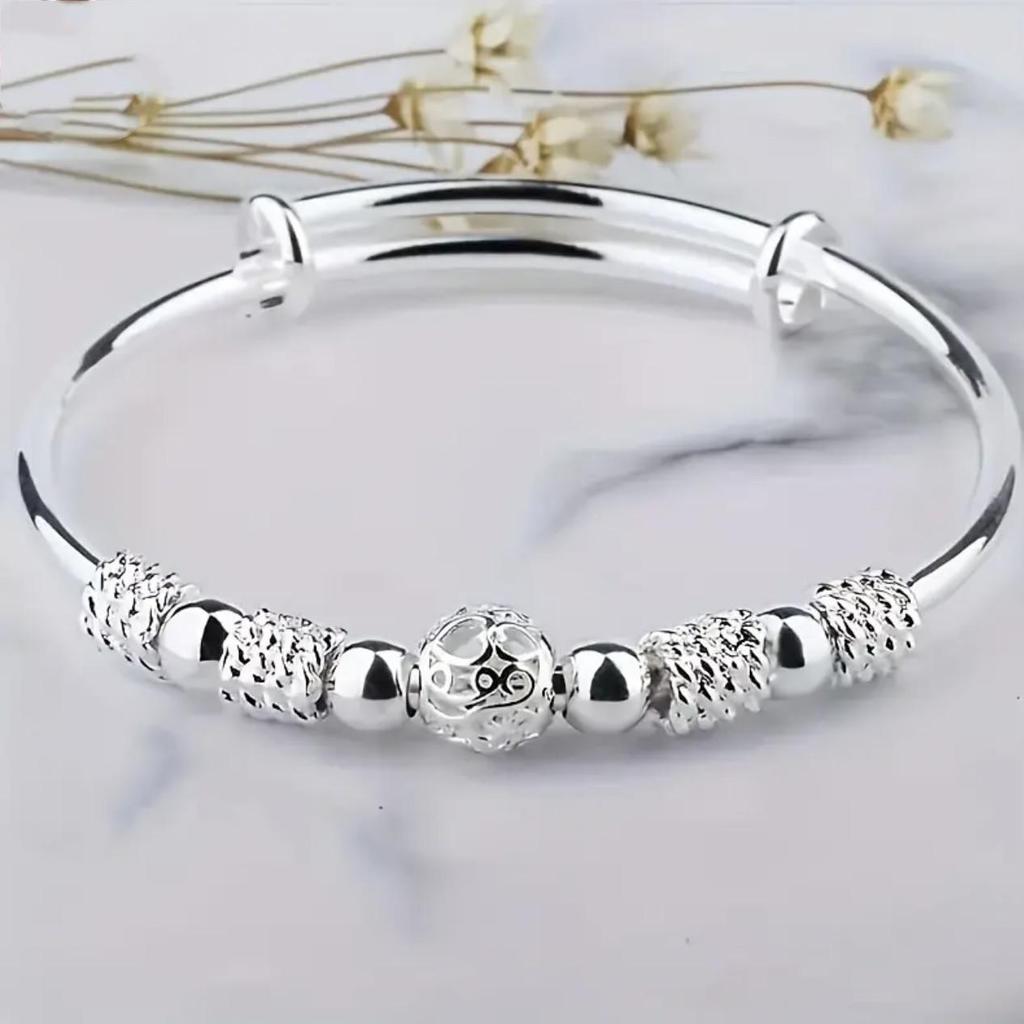 European-Style Silver-Plated Rotating Bead Bracelet for Women: Hollow Exquisite Ball Ornament Jewelry
